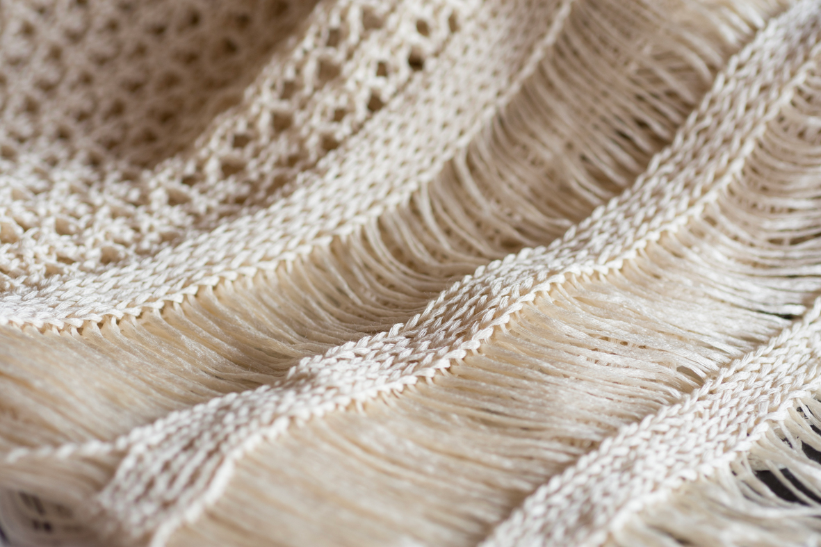 Dettaglio cucitura abbigliamento pronto moda KRIS SRL